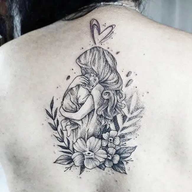 Mom hugging the baby back tattoo by @nacho_rojas_tattoo